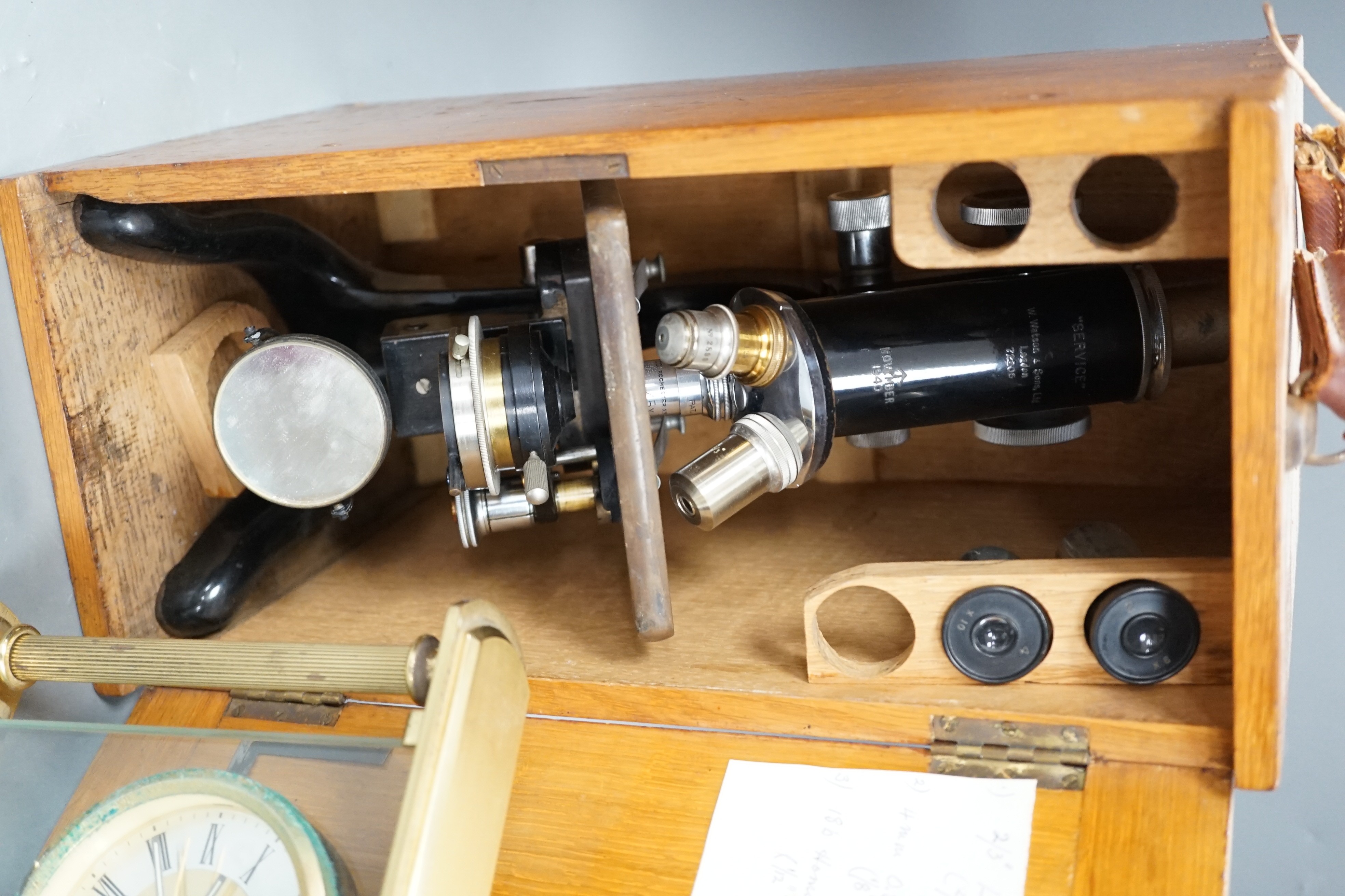 An oak-cased black japanned microscope, case 35cm high, width 16cm, 20cm depth and a brass mantel timepiece